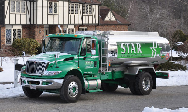 Star Petroleum truck delivering oil to a home